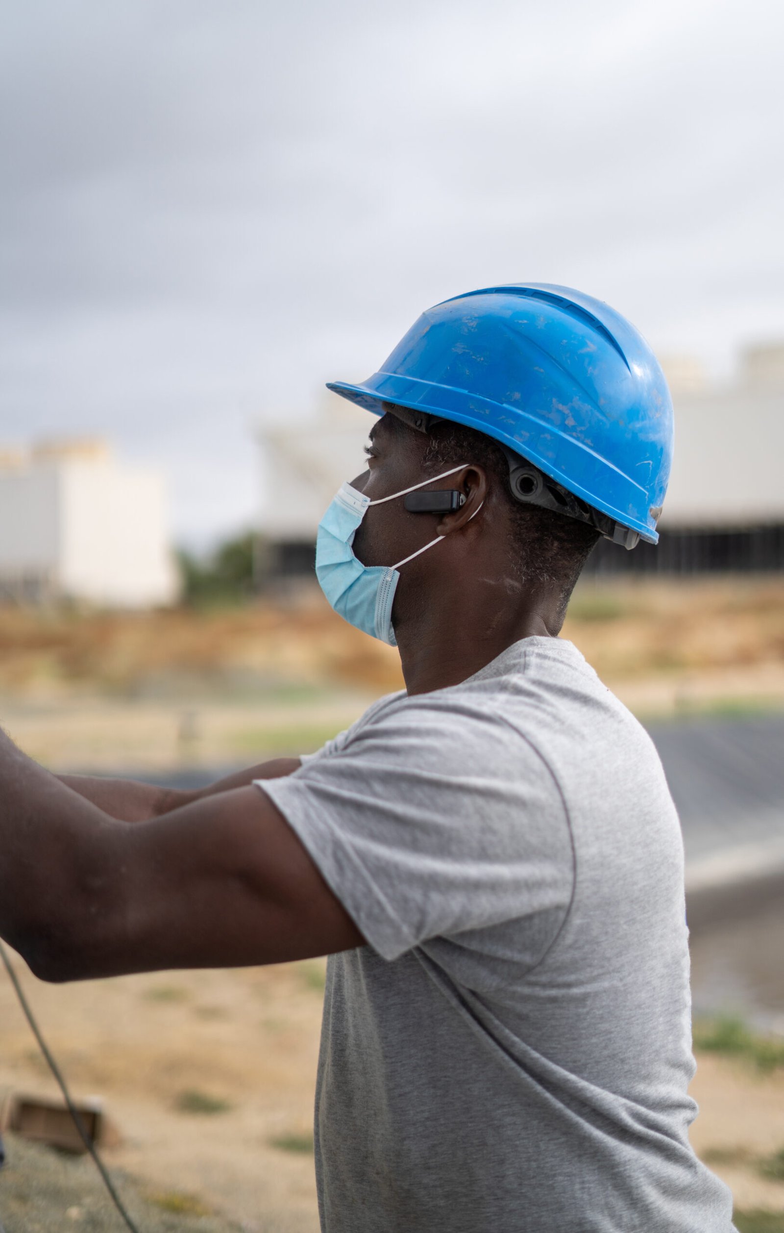 an-afro-american-builder-wearing-a-blue-helmet-and-2026-01-11-10-10-59-utc